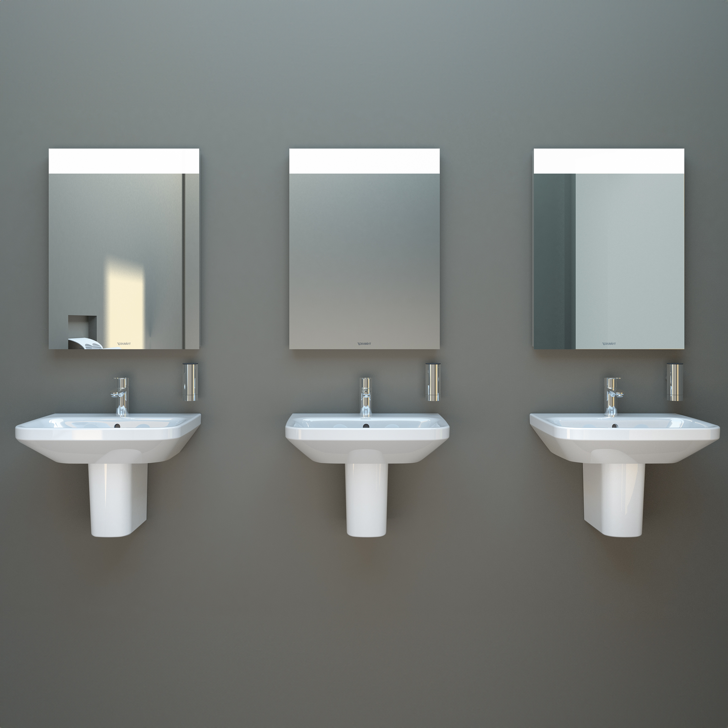3 stycken Durastyle tvättställ från Duravit med en blandare hängandes på en vägg med varsina rektangulära speglar ovan.