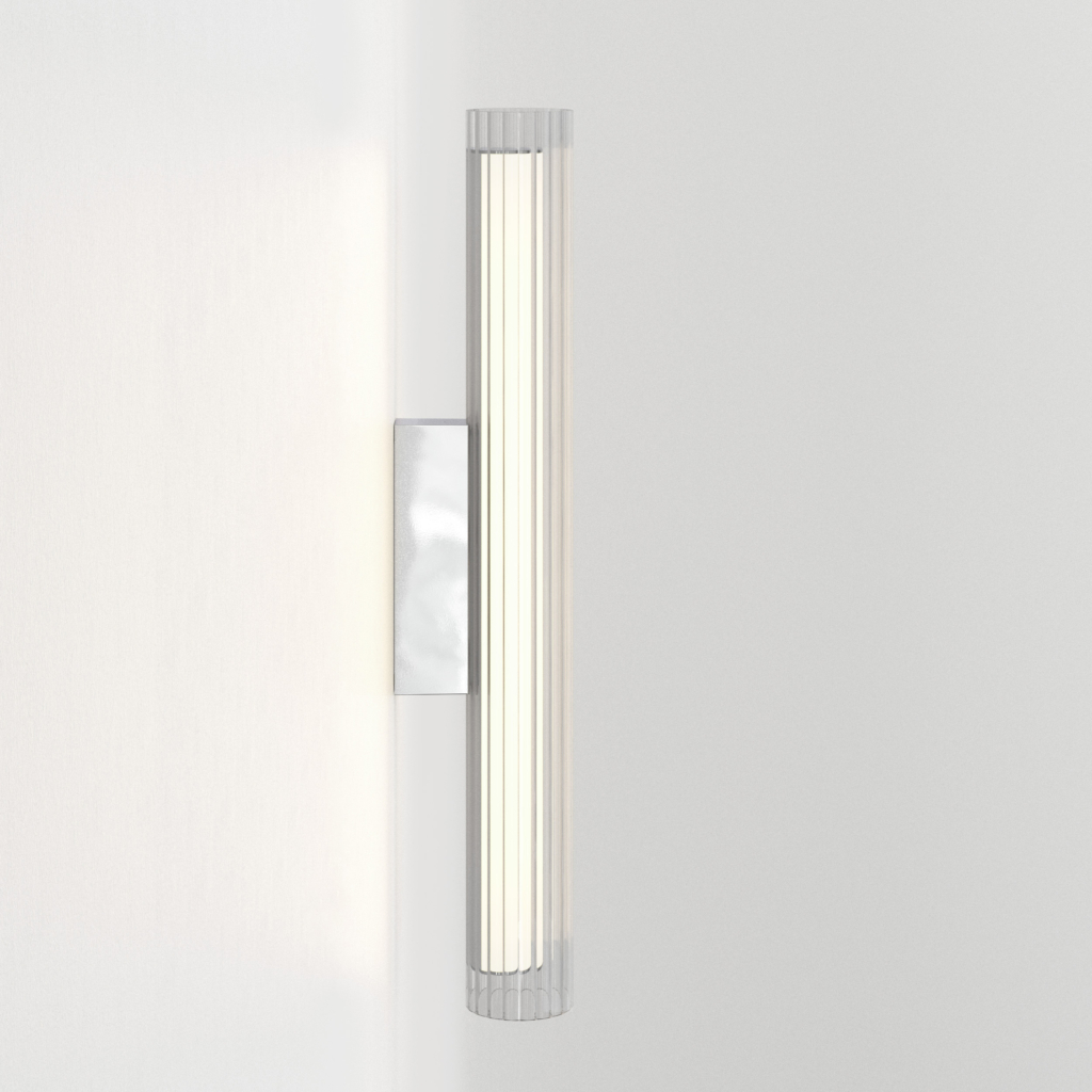 io 665 vägglampa i glas i en cyliderform.
