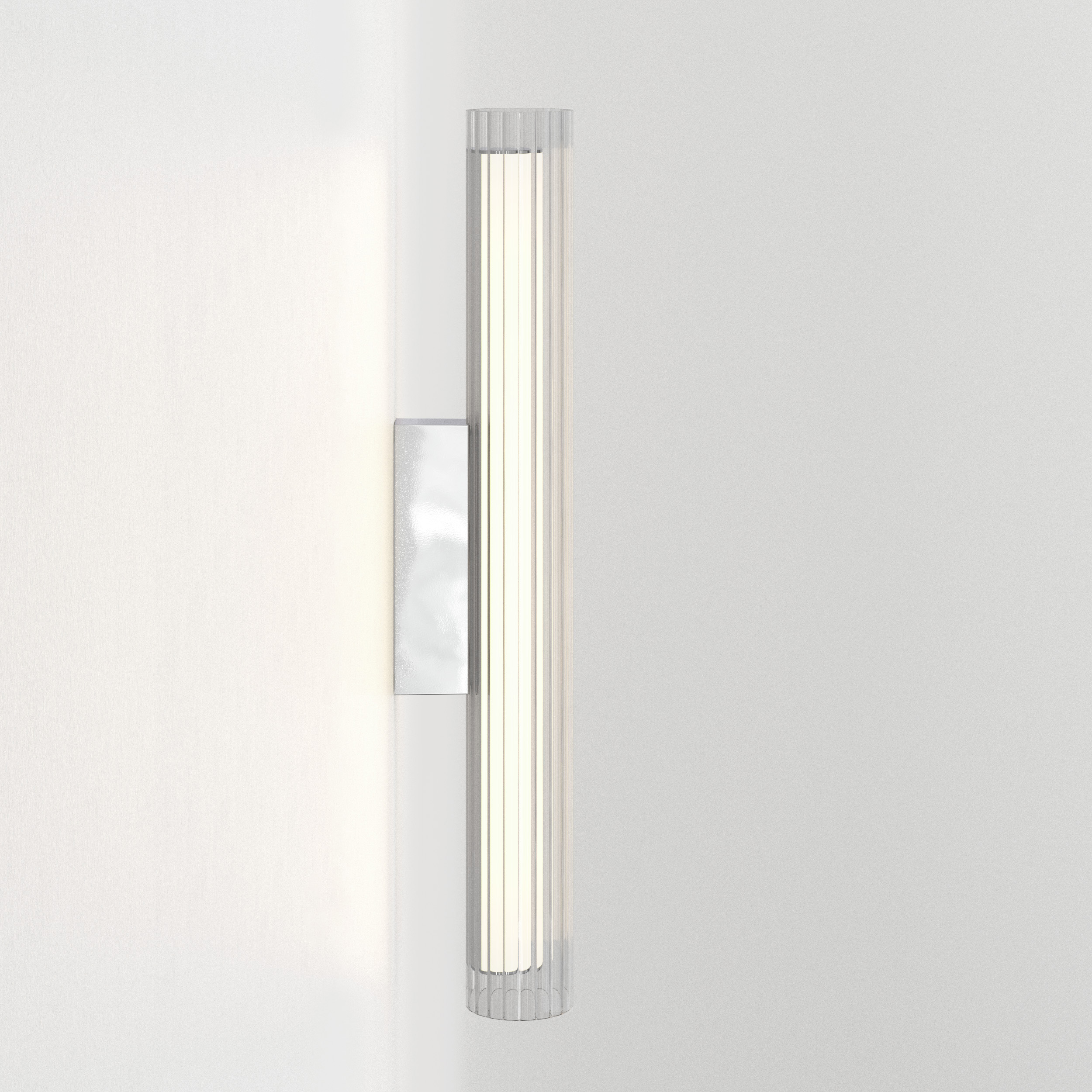 io 665 vägglampa i glas i en cyliderform.