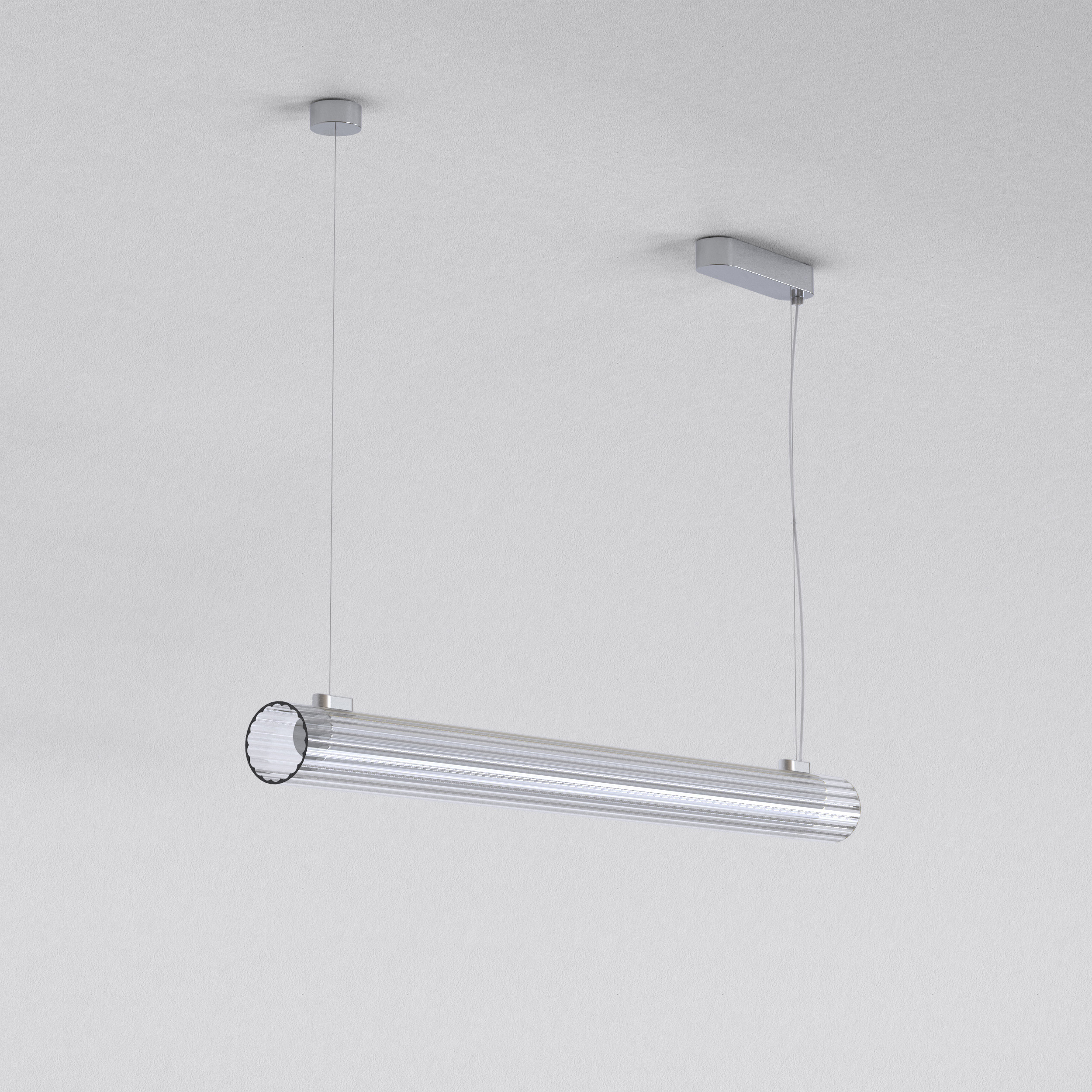 io Pendant 1000 taklampa, är en cylinderformad lampa som hänger från taket i två stållinor.