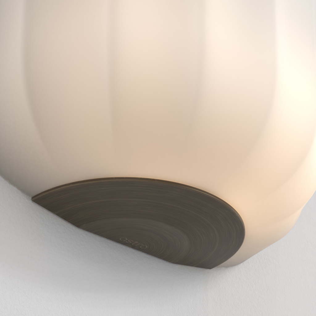 Närbild på en Veo vägglampa.