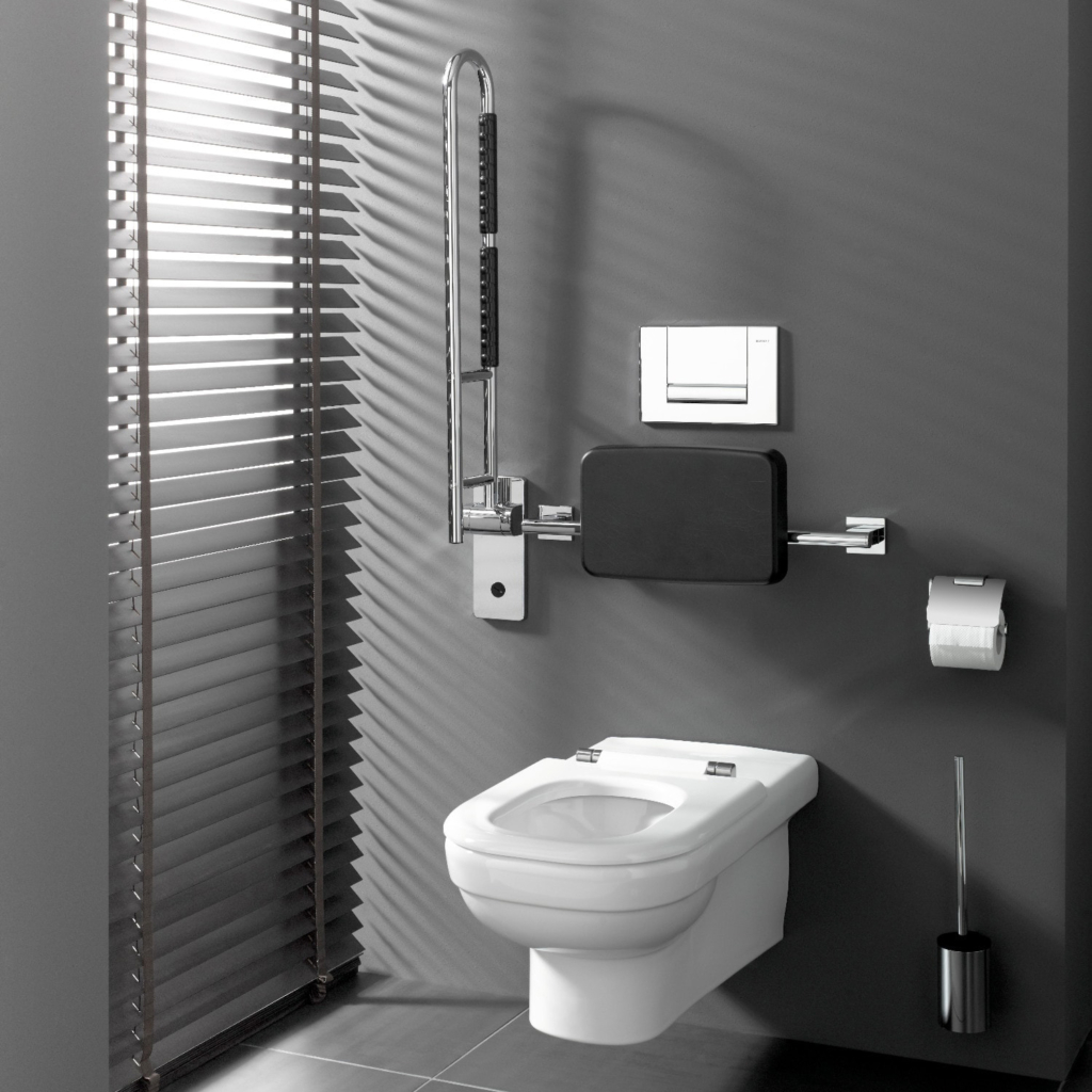 Armstöd till toalett som är uppfällt.