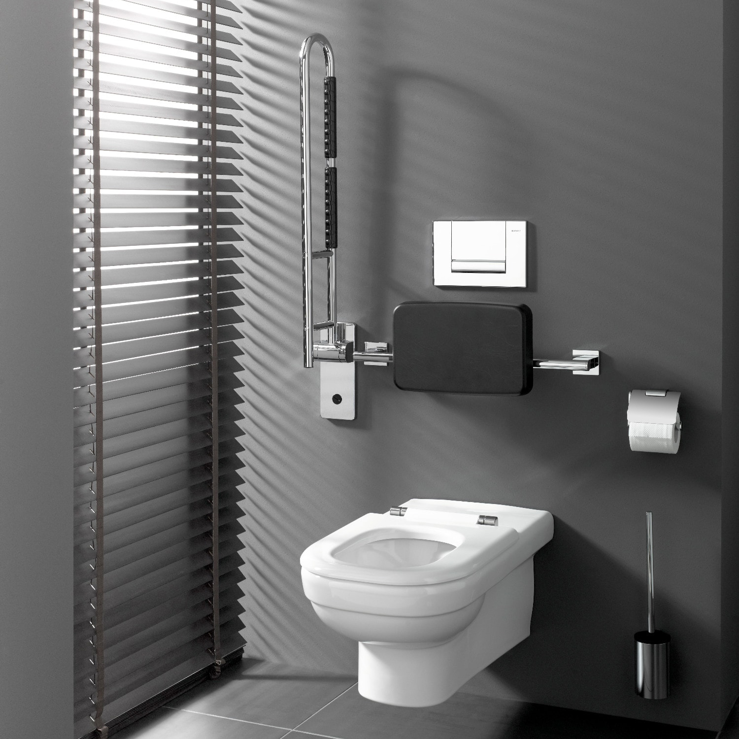 Armstöd till toalett som är uppfällt.