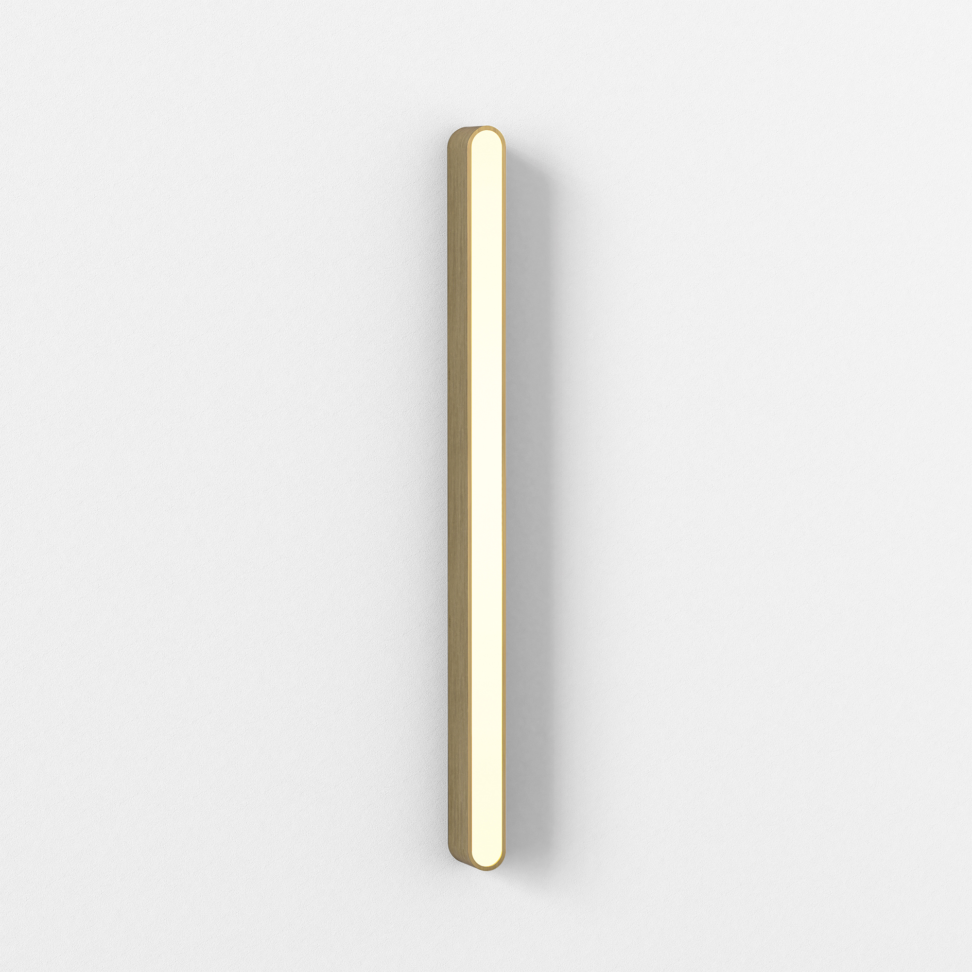 Frilagd produktbild med skuggning på vägglampa Atticus 900 från Astro i matt borstad mässing. Lampan syns snett från sidan.